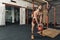 Male Crossfit Trainer swinging Cattle Bell