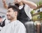 Male customer looking on cutting hair