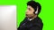 Male customer service representative talking on headset against green background