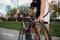 Male cyclist adjusts the bike before competition