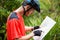 Male cyclist looking at map