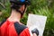 Male cyclist looking at map