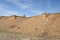 Male cyclist is riding a gravel bike on cliff edge