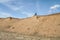 Male cyclist is riding a gravel bike on cliff edge