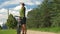 Male cyclist riding on the track, stop and drink water from a bottle. Slow motion