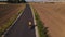 Male cyclist training on bicycle on countryside road