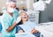 Male dentist with female patient during checkup