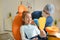 a male dentist teaches a little girl how to brush her teeth properly with a toothbrush