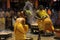 Male devotees perform holy bath ritual with hot turmeric water