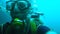 Male in diving equipment moving under water, recreational extreme sport, amateur