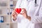 The male doctor cardiologist holding heart model