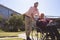 Male doctor caring disabled senior patient women in wheelchair