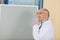 Male Doctor With Finger On Lips Standing By Flipchart