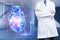 Male doctor with heart hologram