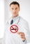 Male doctor holding no smoking sign