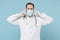 Male doctor man in medical gown sterile face mask gloves isolated on blue background. Epidemic pandemic coronavirus 2019