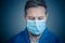 Male Doctor or Nurse Wearing Protective face medical Mask. Save lives from Covid-19 Outbreak