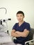 Male doctor ophthalmologist in the workplace