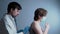 Male doctor pulmonologist makes a medical examination of a female patient with a coronavirus and has problems with the