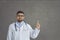 Male doctor with raised finger give some advice or suggestion on studio space