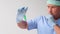 Male doctor, scientist, laboratory assistant, holding a bottle of liquid, researching a vaccine, a new medicine, concept of