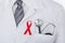 Male Doctor With Stethoscope And Aids Ribbon