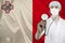 Male doctor with a stethoscope on the background of the Malta silk national flag, concept of national medical care, health,
