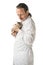 male doctor veterinarian holds a small kitten in his arms.