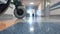 Male Doctor Walking through the Long Hallway in Hospital