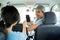 Male driver shows his smartphone to approve the payment