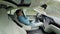 Male driver sleeping behind the wheel in self-driving autonomous electric car