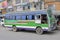 Male driver stops his mini bus at bus stop in Kathmandu, Nepal