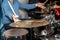 Male drum player hands holding cymbals with both hands and sticks. Drummer