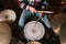 Male drummer playing drums in studio