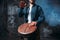 Male drummer playing on wooden drum