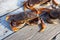 A male Dungeness crab sitting on a dock with other crabs