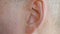 Male ear close up. Close up view man moving his ear, body part.