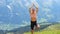 Male elderly tourist with naked torso doing yoga, exercise, beautiful mountain landscape, swiss alps, outdoor activities concept,