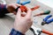 A male electrician changes the plug on an electric wire. Working with electrical tools. Stripper, crimp, screwdriver, wire cutters