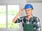 Male electrician wearing hardhat indoors