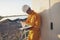 Male Electricity Engineer inspect and maintenance electric power system in generator at solar plant. Technician checklist work and