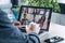 Male employee speaking on video call with diverse colleagues on online briefing with laptop at home