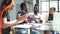 male employees in formal clothing doing handshake during business meeting in office