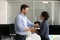 Male employer handshake excited worker greeting with promotion