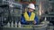 Male engineer is observing transportation of plastic bottles