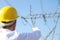 Male engineer standing at electricity station