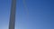 Male engineer standing on a wind mill in the wind farm 4k