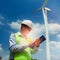 Male Engineer or tecnician at Work wind turbine station,wind ene