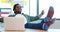 Male executive relaxing with feet up at desk