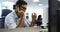 Male executive talking on telephone at desk